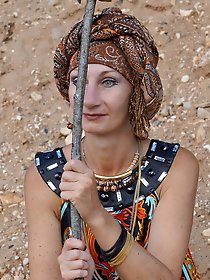 With spear wearing in colorful dress