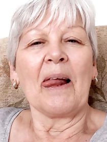 Insatiable dame is taking off her bra for a photoshoot