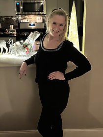 Hot MILF Tia posing in pink underwear for a photo session