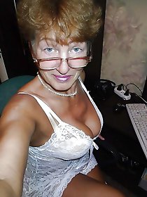 Lovely mature dame is getting naked