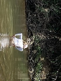 Young mature womans buttocks outdoors